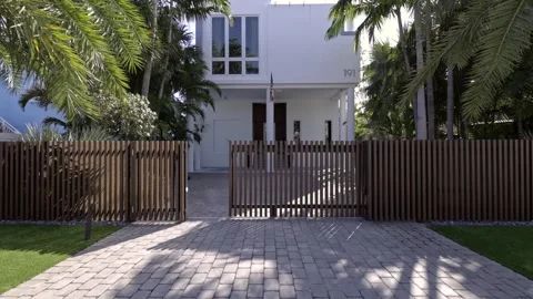 Modern building with swimming pool, trees, chairs reflecting pool and ocean Stock Footage 250260882