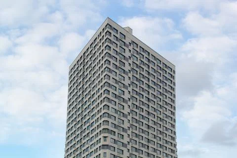 A modern building in triangular shape on a background of the sky Stock Photos