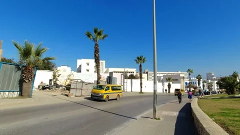 A modern building under construction and a busy street near Medina, Sousse Stock Footage 252489036