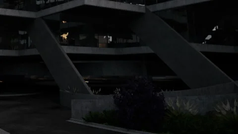 Modern building with unique structure at night under artificial lights Stock Footage 342064270