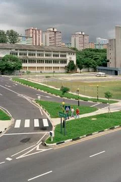 Modern buildings behind traffic intersection, Singapore Stock Photos