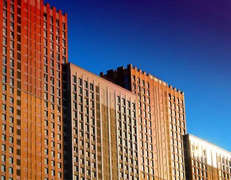 Modern buildings during dramatic sunset architecture backdrop Stock Photos