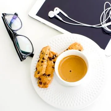 Modern business background. Computer tablet with eyeglasses and white coffee Stock Photos