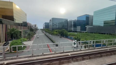 Modern business district view from moving train window Parañaque Stock Footage 337980010