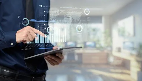 Modern Business Professional Analyzing Digital Data on Tablet with Graphs a.. Foto stock