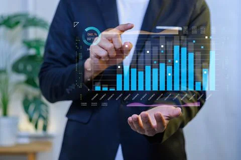 Modern Businessman Analyzing Data with Digital Dashboard Visualization Foto stock