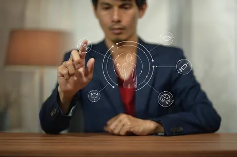 Modern Businessman Engages with Digital Interface and Data Visualization Stock Photos