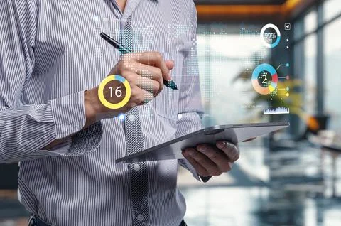 Modern Businessman Using Tablet with Data Visualization Elements Stock Photos