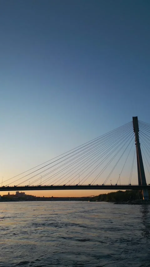 Modern cable bridge over Vistula river at sunset, contemporary structures of Stock Footage 274749598