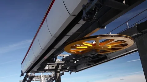 Modern cable car lifting gear wheel on blue sky Video stock 72613570