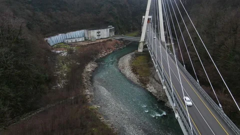 Modern cable-stayed bridge across the Mzumta River in a mountainous area. Sochi. Stock Footage 169742873