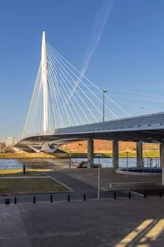 Modern cable-stayed bridge "Prins Clausbrug' over water under a clear blue sk Stock Photos