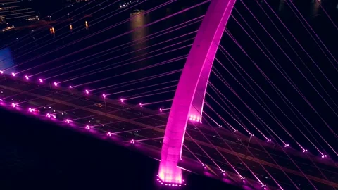 Modern cable-stayed Thu Thiem suspension bridge over Saigon river with colourful Stock Footage 322114435