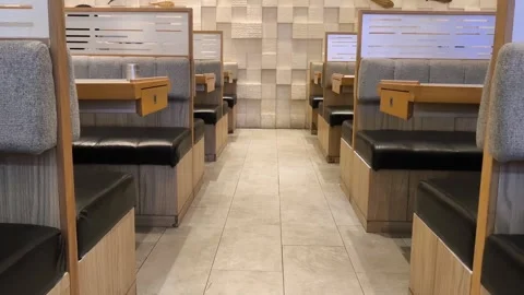 Modern cafe interior with cozy booth seating Stock Footage 339324224