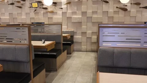 Modern cafe interior with cozy booth seating Stock Footage 339565067