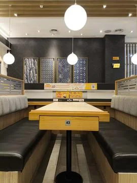 Modern cafe interior with cozy booth seating Stock Photos