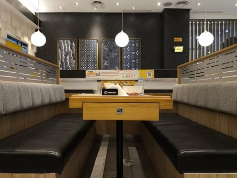 Modern cafe interior with cozy booth seating Stock Photos