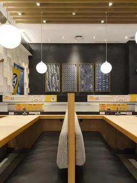 Modern cafe interior with cozy booth seating Stock-Fotos