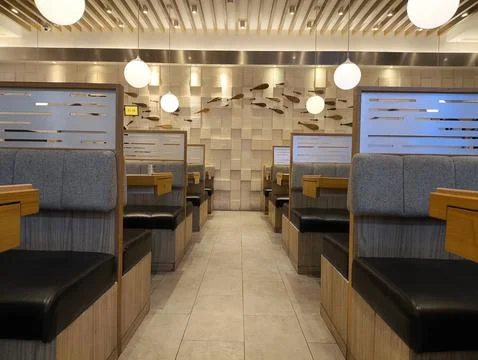 Modern cafe interior with cozy booth seating Foto stock