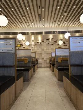 Modern cafe interior with cozy booth seating Fotos de archivo