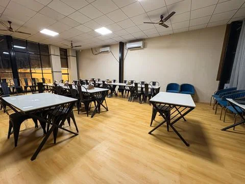 Modern cafe interior with empty tables and chairs in casual dining restaura.. Stock Photos