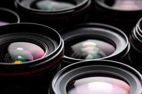 Modern camera lenses with reflections, low key image Stock Photos