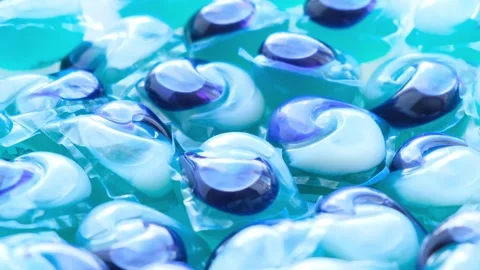 Modern capsules for washing clothes in an automatic machine. Washing clothes Stock-Footage 253112347