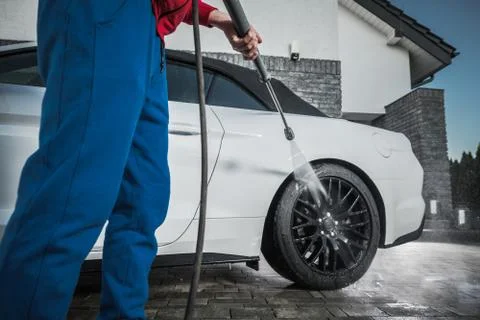 Modern Car Cleaning Using Pressure Washer. Stock Photos