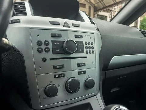 Modern car dashboard with sleek controls and a stylish design captured insi.. 스톡 사진
