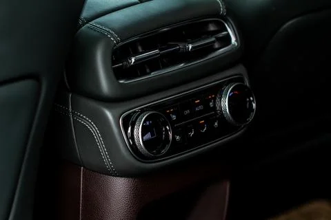 Modern car. Digital second row seat temperature control. Car air conditioning Foto stock