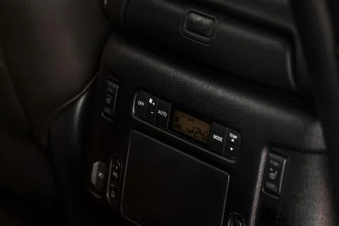 Modern car. Digital second row seat temperature control. Car air conditioning Stock Photos