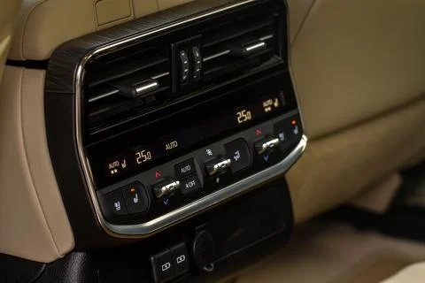 Modern car. Digital second row seat temperature control. Car air conditioning Stock Photos