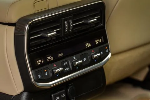 Modern car. Digital second row seat temperature control. Car air conditioning Stock Photos