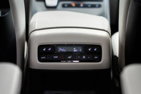 Modern car. Digital second row seat temperature control. Car air conditioning Stock Photos