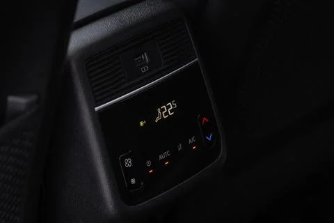 Modern car. Digital second row seat temperature control. Car air conditioning Stock Photos