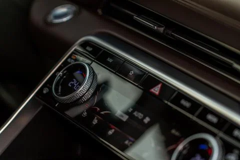 Modern car. Drivers temperature control. Car air conditioning system button.  Stock Photos