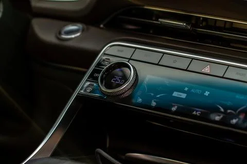 Modern car. Drivers temperature control. Car air conditioning system button.  Stock Photos