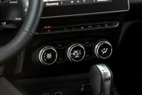 Modern car. Drivers temperature control. Car air conditioning system button.  Stock Photos