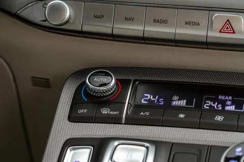 Modern car. Drivers temperature control. Car air conditioning system button.  Stock Photos