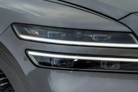 Modern car headlight close up view. LED Headlight of a car. Stock Photos