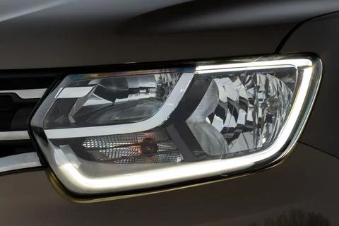 Modern car headlight close up view. LED Headlight of a car. Stock Photos