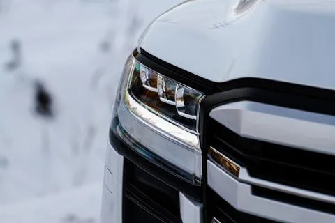 Modern car headlight close up view. LED Headlight of a car. Stock Photos