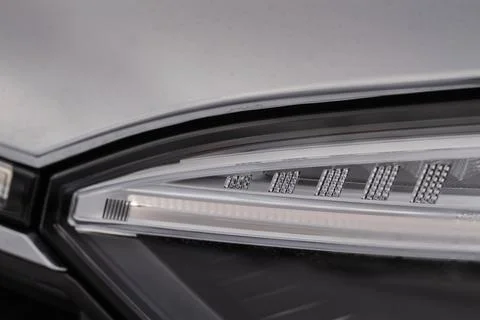 Modern car headlight close up view. LED Headlight of a car. Stock Photos