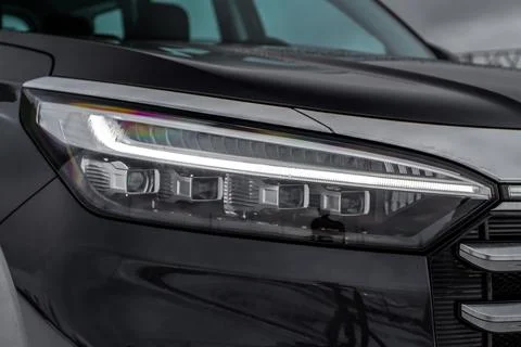 Modern car headlight close up view. LED Headlight of a car. Stock Photos