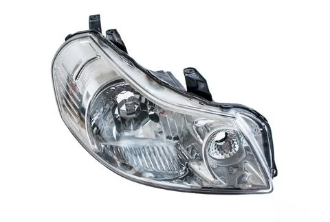 Modern car headlight. Object isolated on white background Stock Photos