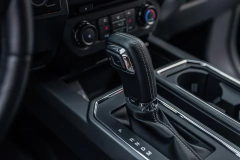 Modern car inside. Control panel and automatic transmission background. Detai Stock Photos