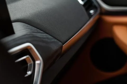 Modern car interior close up view with metallic and plastic details. Interior Stock Photos