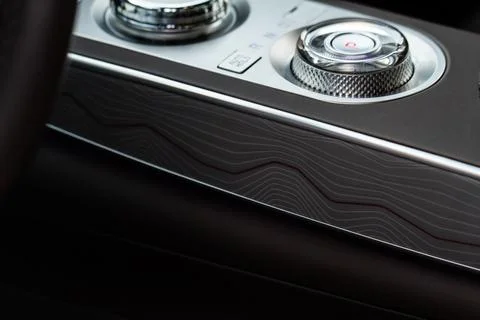 Modern car interior close up view with metallic and plastic details. Interior Stock Photos