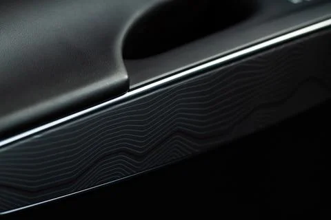 Modern car interior close up view with metallic and plastic details. Interior Stock Photos