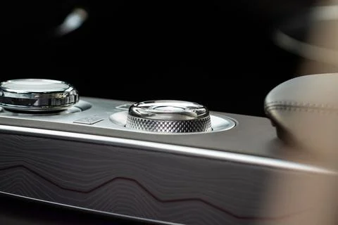 Modern car interior close up view with metallic and plastic details. Interior Stock Photos